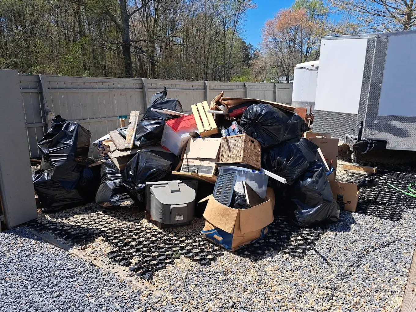 Mixed household debris and bagged junk removal